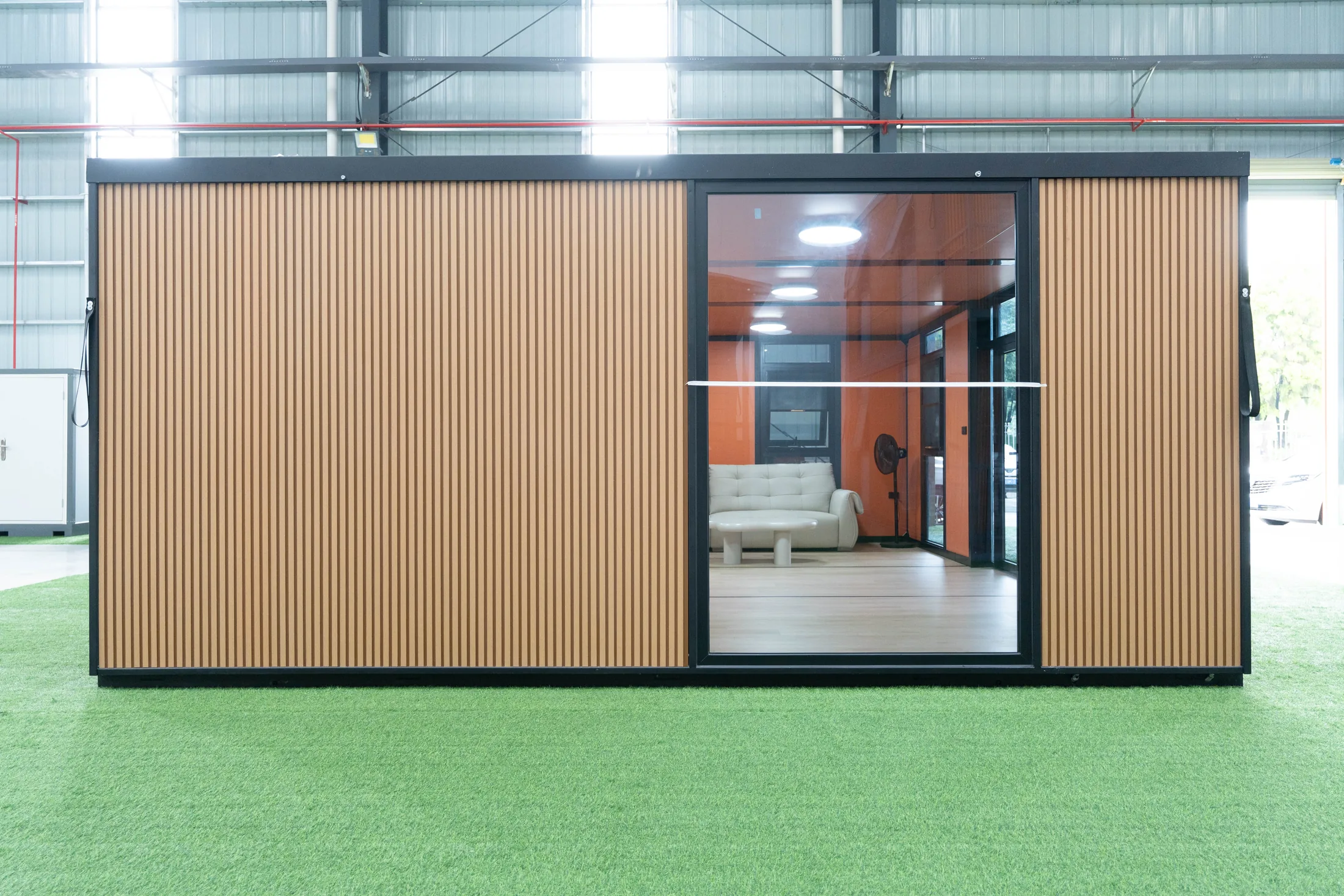 Full-height glass wall in the wood-finish 20 ft expandable house