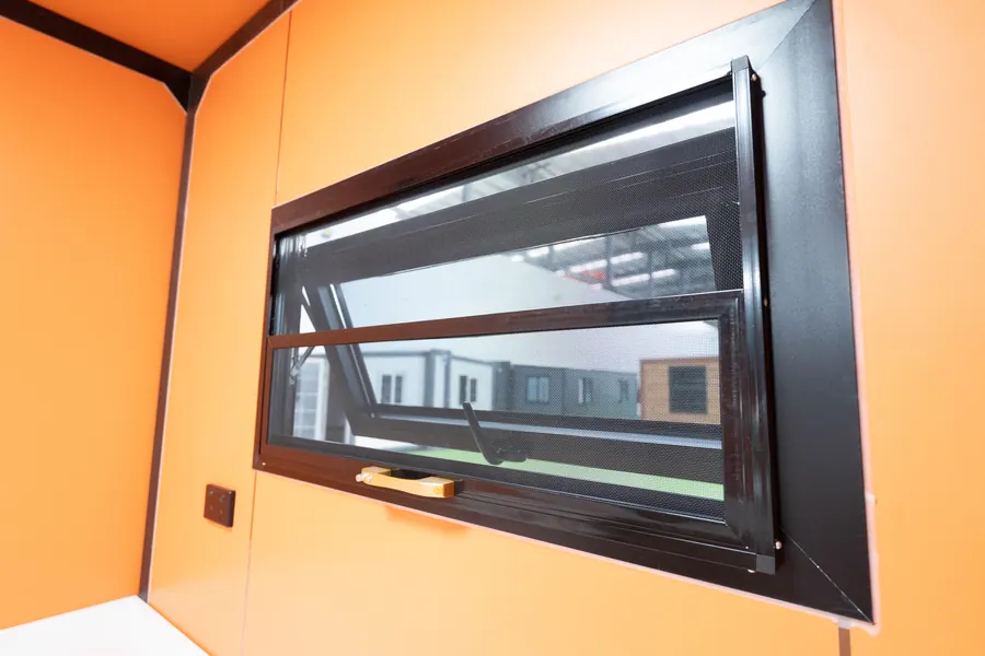 Black-framed awning window inside the house