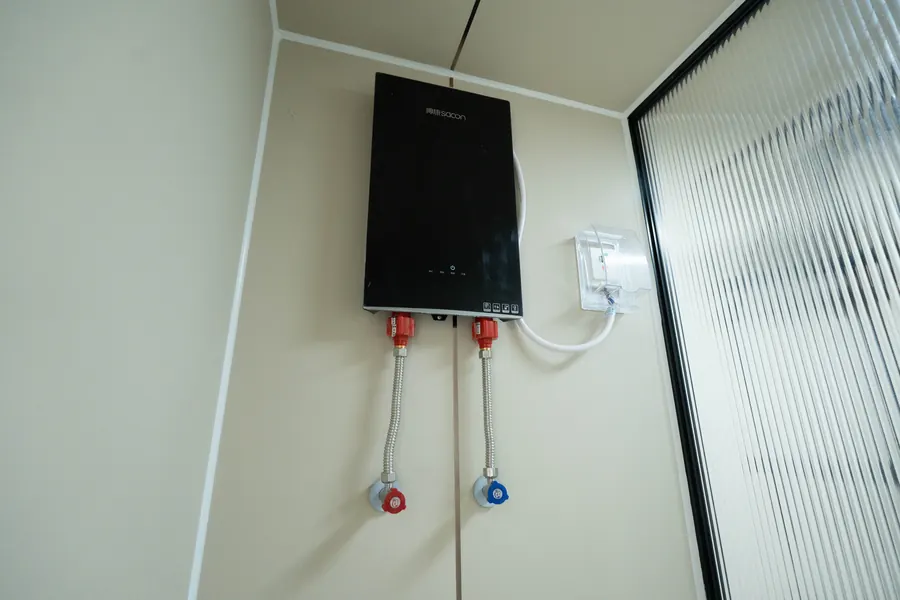 Electric water heater inside the bathroom