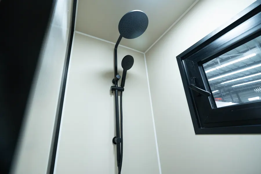Black shower fixtures and awning window