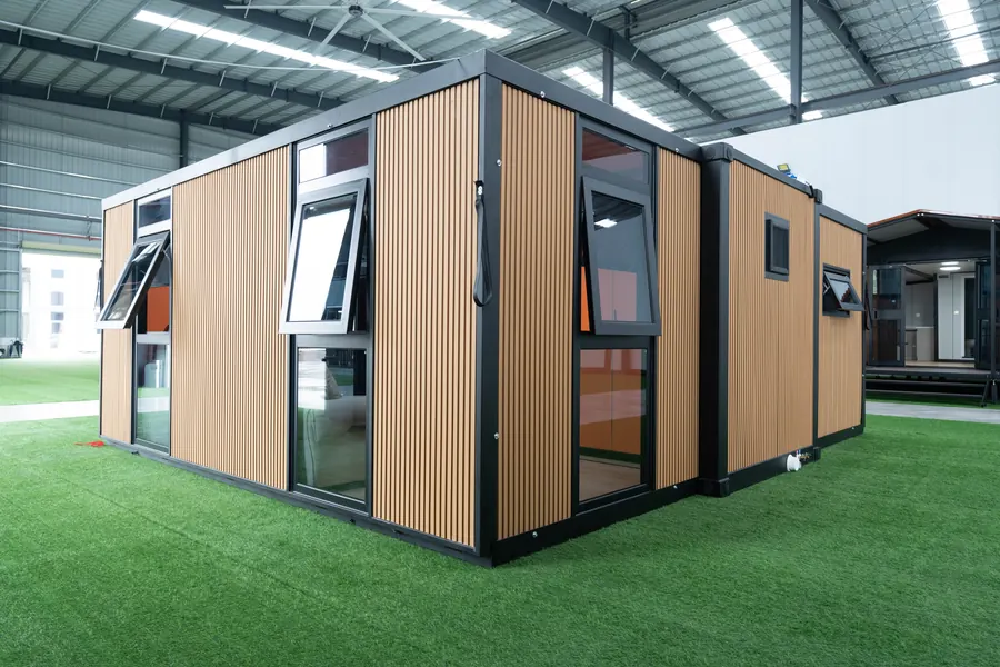 Side of the expandable house with awning windows