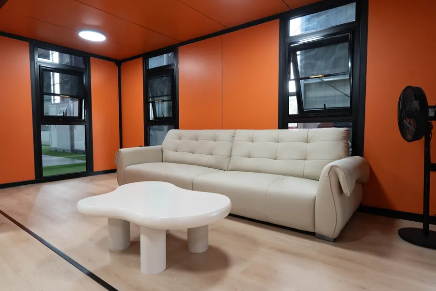 Sofa living area with orange wall panels