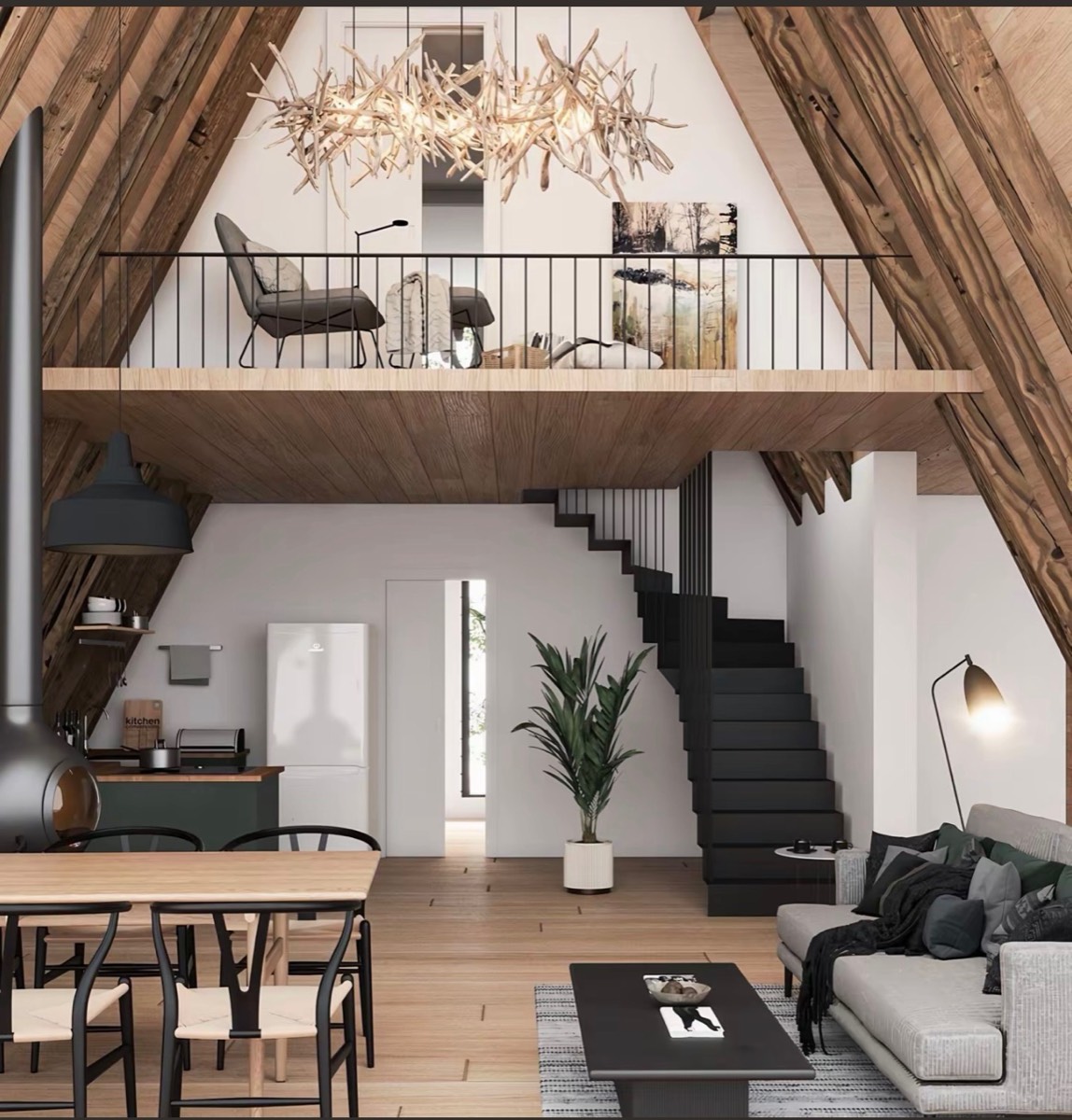 Open-plan A-frame cabin interior with kitchen, living area and loft