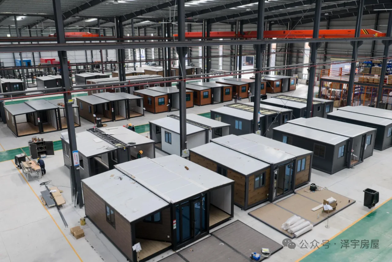 Multiple expandable house units arranged across the YARIS factory production floor