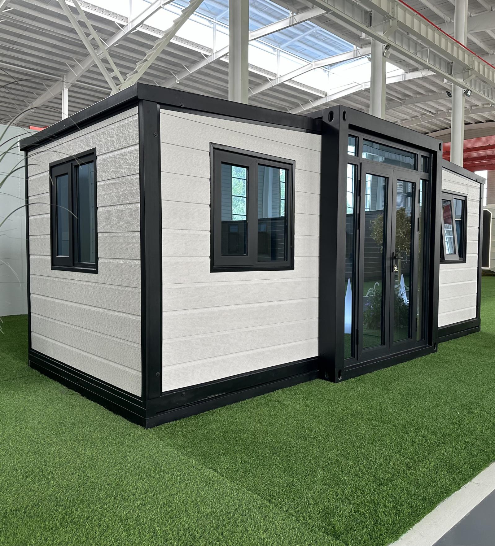 10 ft double-wing expandable house with white facade and black frame