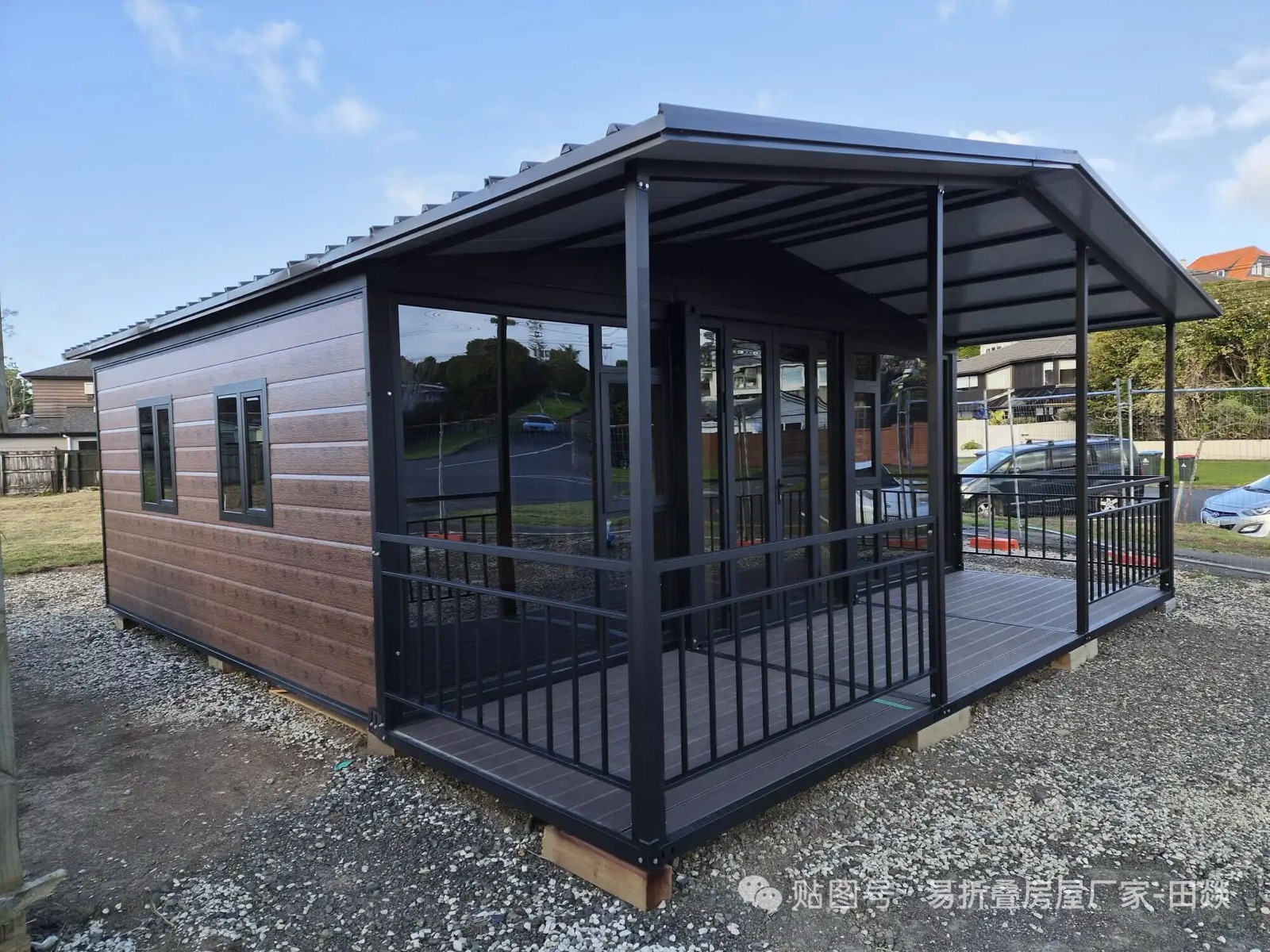 Finished prefabricated steel house with covered veranda and glazed entrance