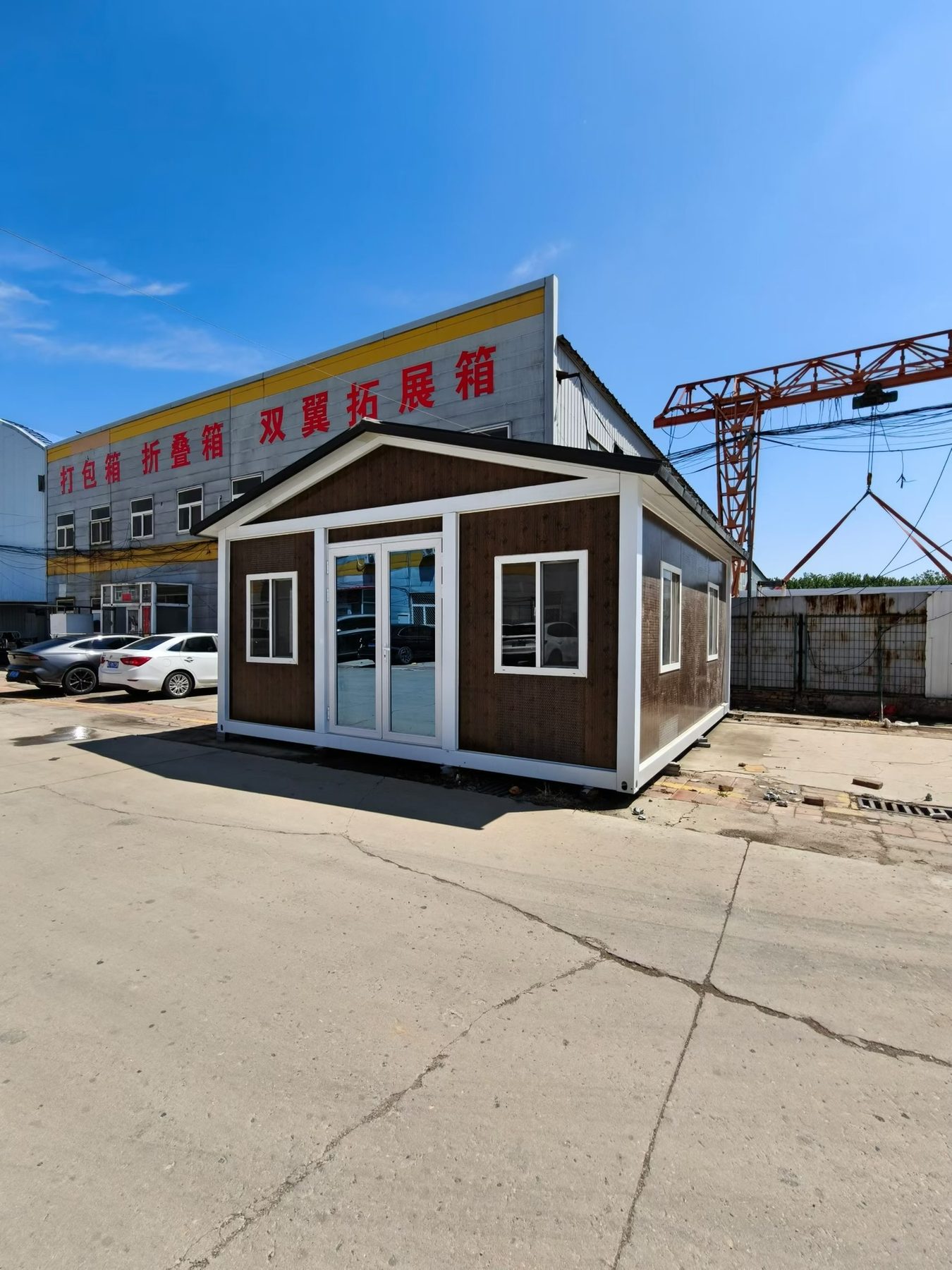 Wood-finish modular office displayed at the factory