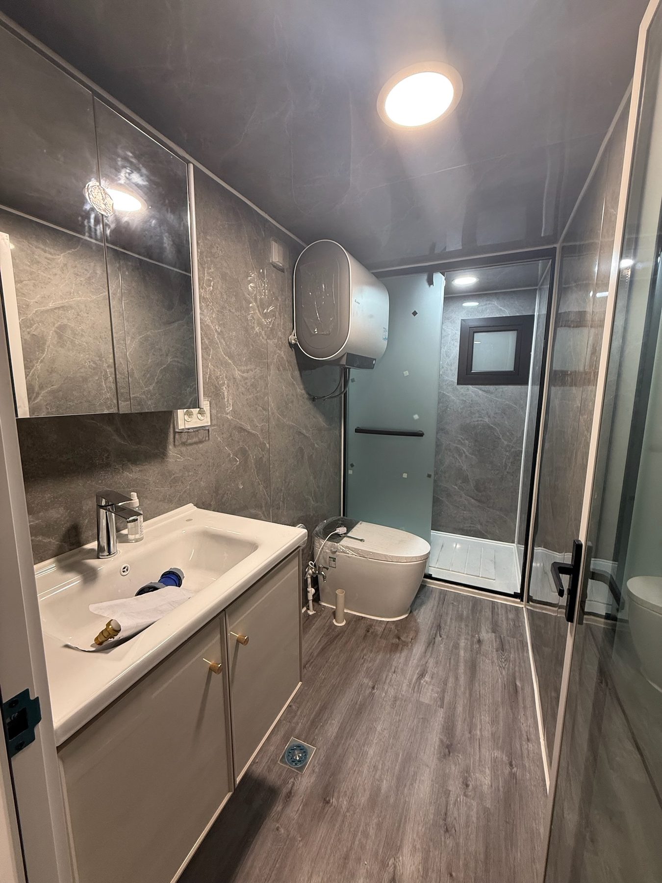 Finished modular house bathroom with shower enclosure
