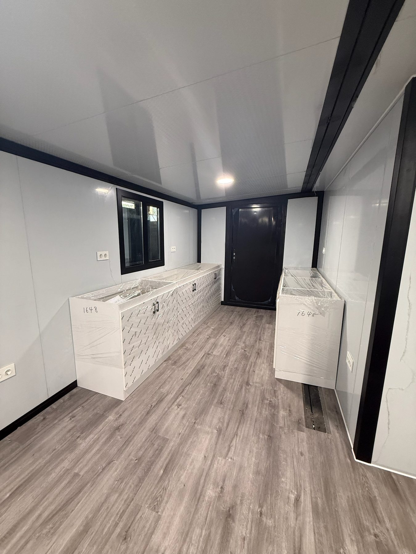Compact kitchen cabinetry inside a modular house